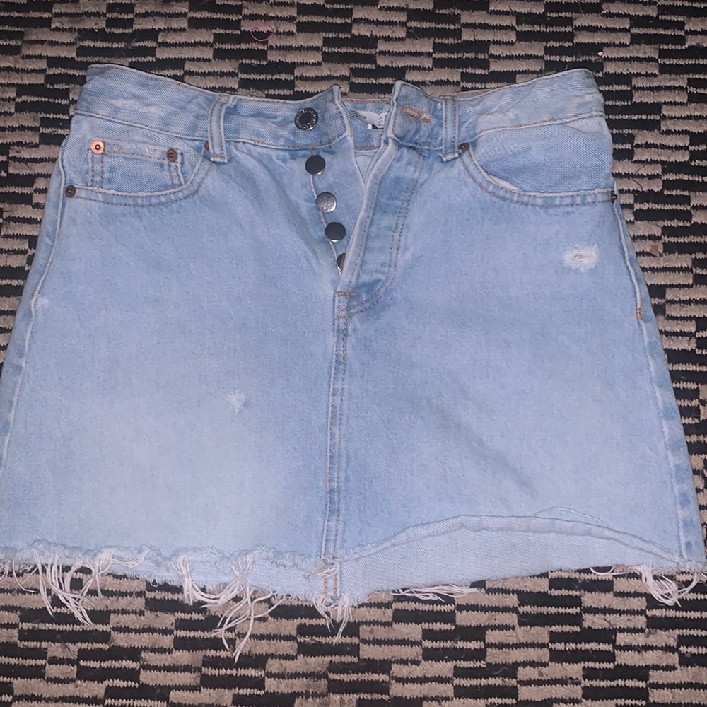 Little cute short light jean skirt